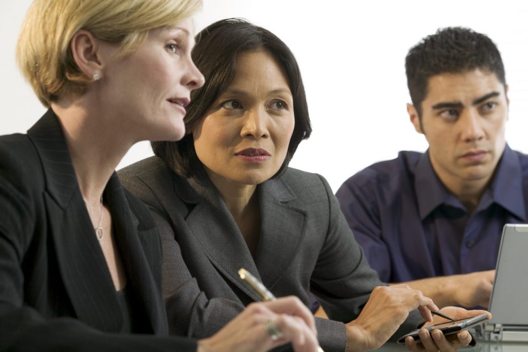 Three-person real estate team working on a project 